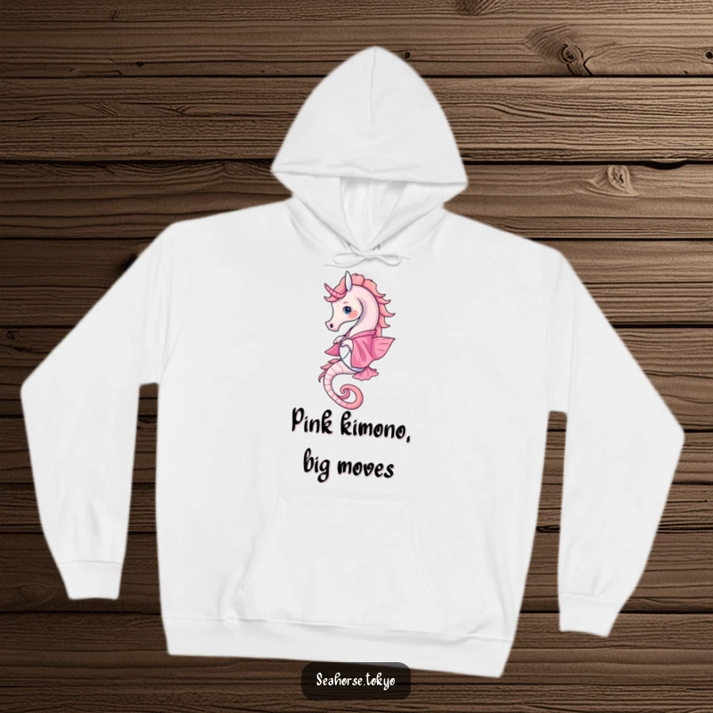 Funny Hoodie featuring a seahorse in a pink kimono elegantly twirling, offering warmth and a touch of undersea grace.