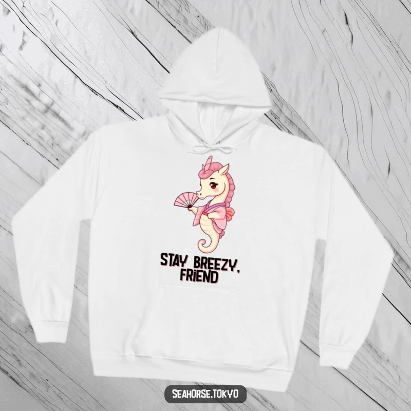 Funny Hoodie showcasing a tiny seahorse in a pink kimono, playfully waving a small fan, perfect for chilly days.