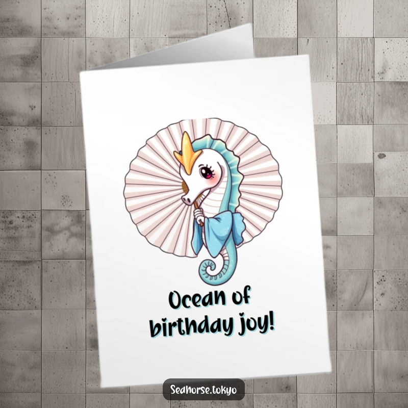 Free printable birthday card featuring a charming seahorse in a blue kimono playfully peeking from behind a large fan, ready to surprise.
